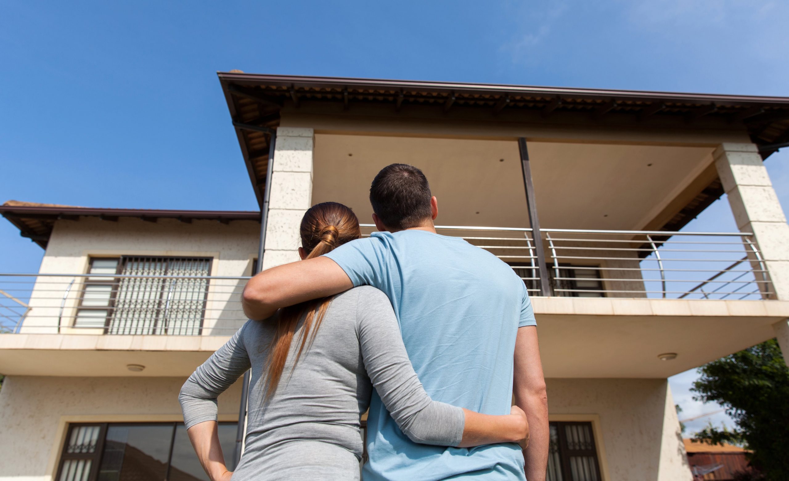 Couple looking at their home: Home Loans Australia